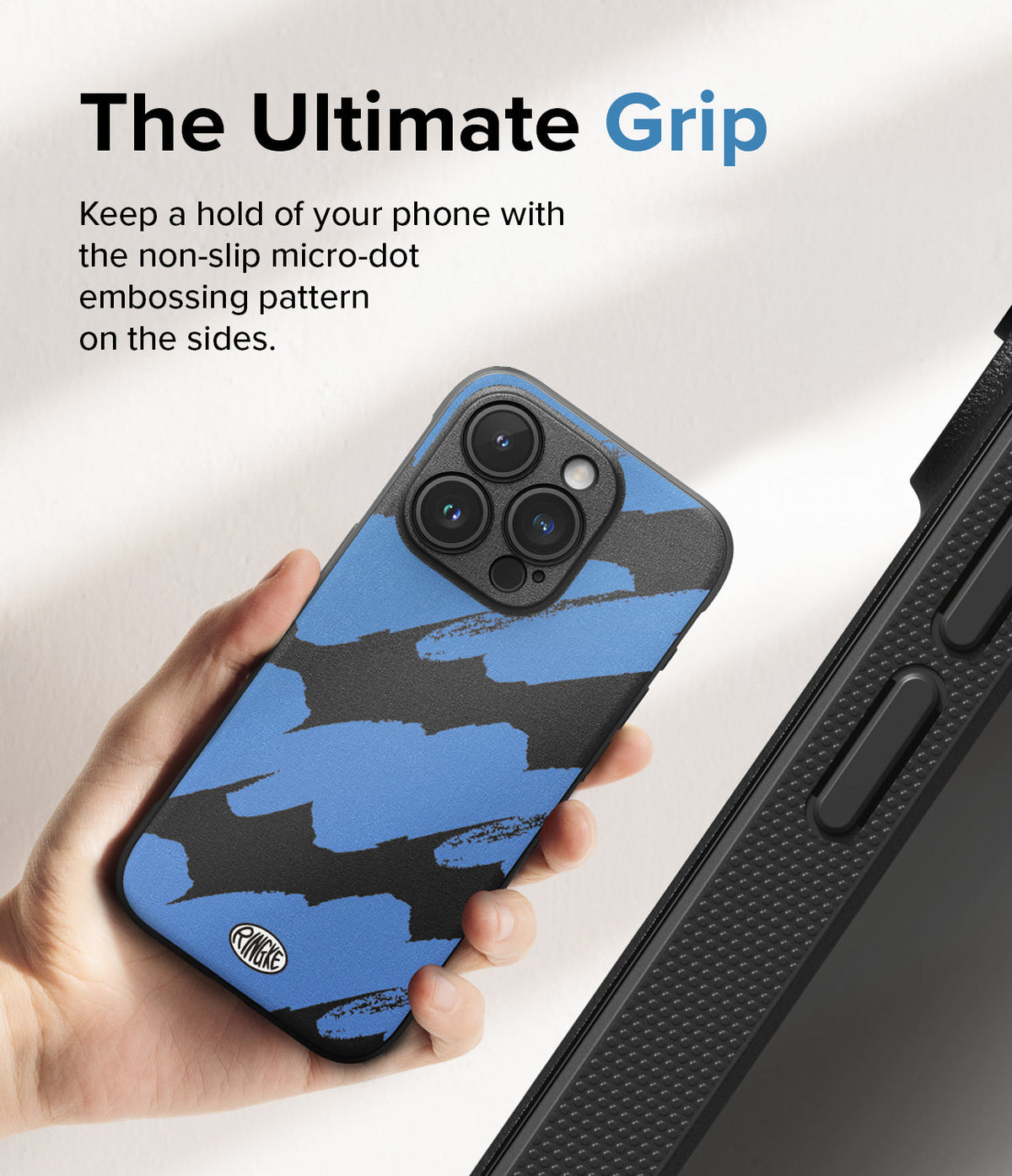 iPhone 15 Pro Max Case | Onyx Design - Hand holding a blue and black brushstroke patterned phone case with micro-dot side grip.