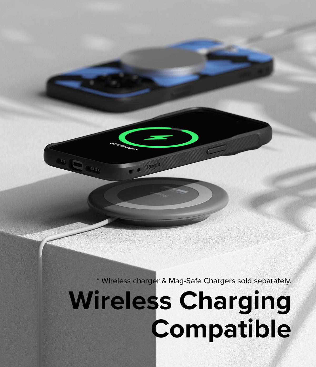 iPhone 15 Pro Max Case | Onyx Design - iPhone 15 Pro Max in a black case wirelessly charging on a circular pad.