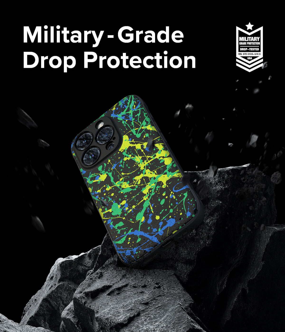 iPhone 15 Pro Max Case | Onyx Design - Paint-splattered phone case on a rock with military-grade drop protection text.
