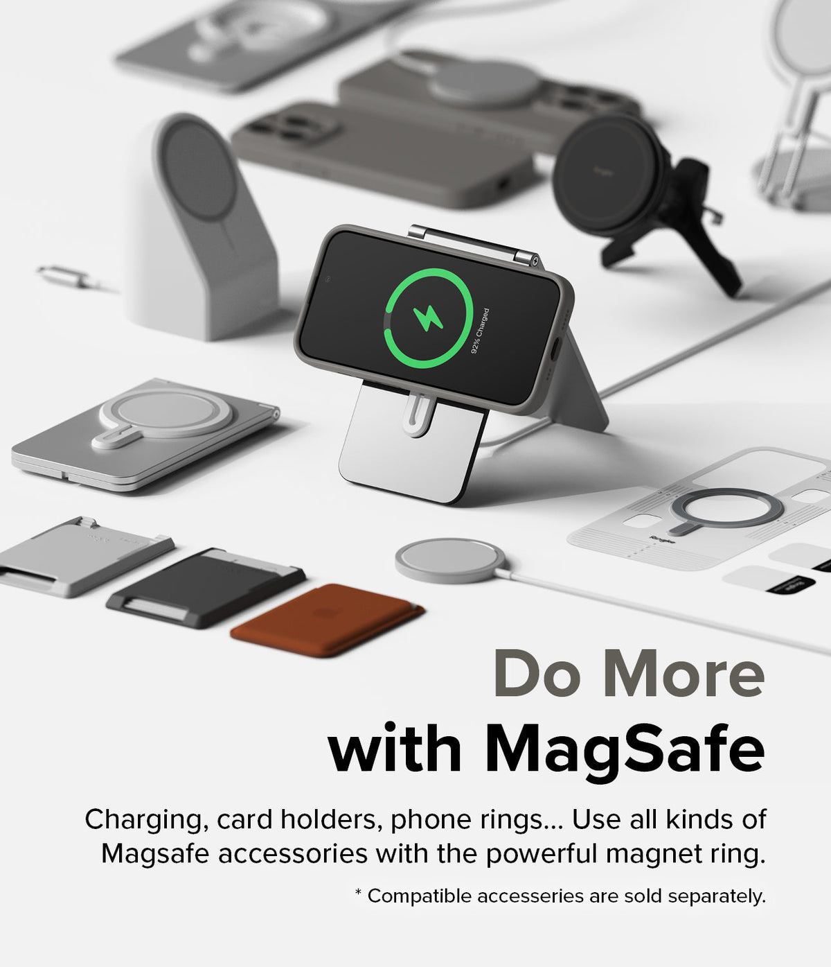 iPhone 15 Pro Max Case | Silicone Magnetic - iPhone 15 Pro Max in a grey magnetic case charging on a stand among various MagSafe accessories.