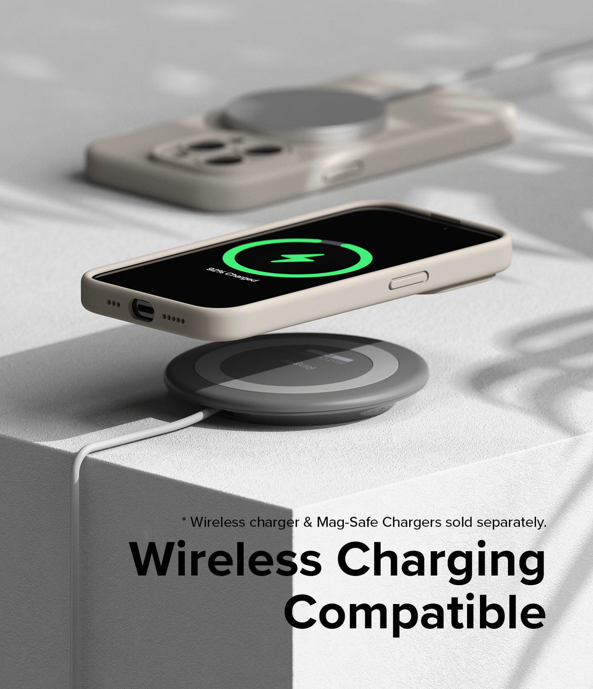 iPhone 15 Pro Max Case | Silicone Magnetic - Beige phone case on a wireless charger showing a charging screen icon.