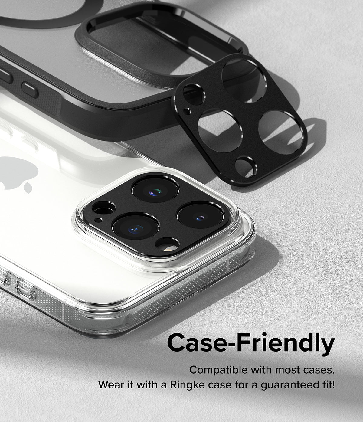 iPhone 15 Pro Max / 15 Pro | Camera Styling - Black camera lens protector being applied to an iPhone with a clear case.