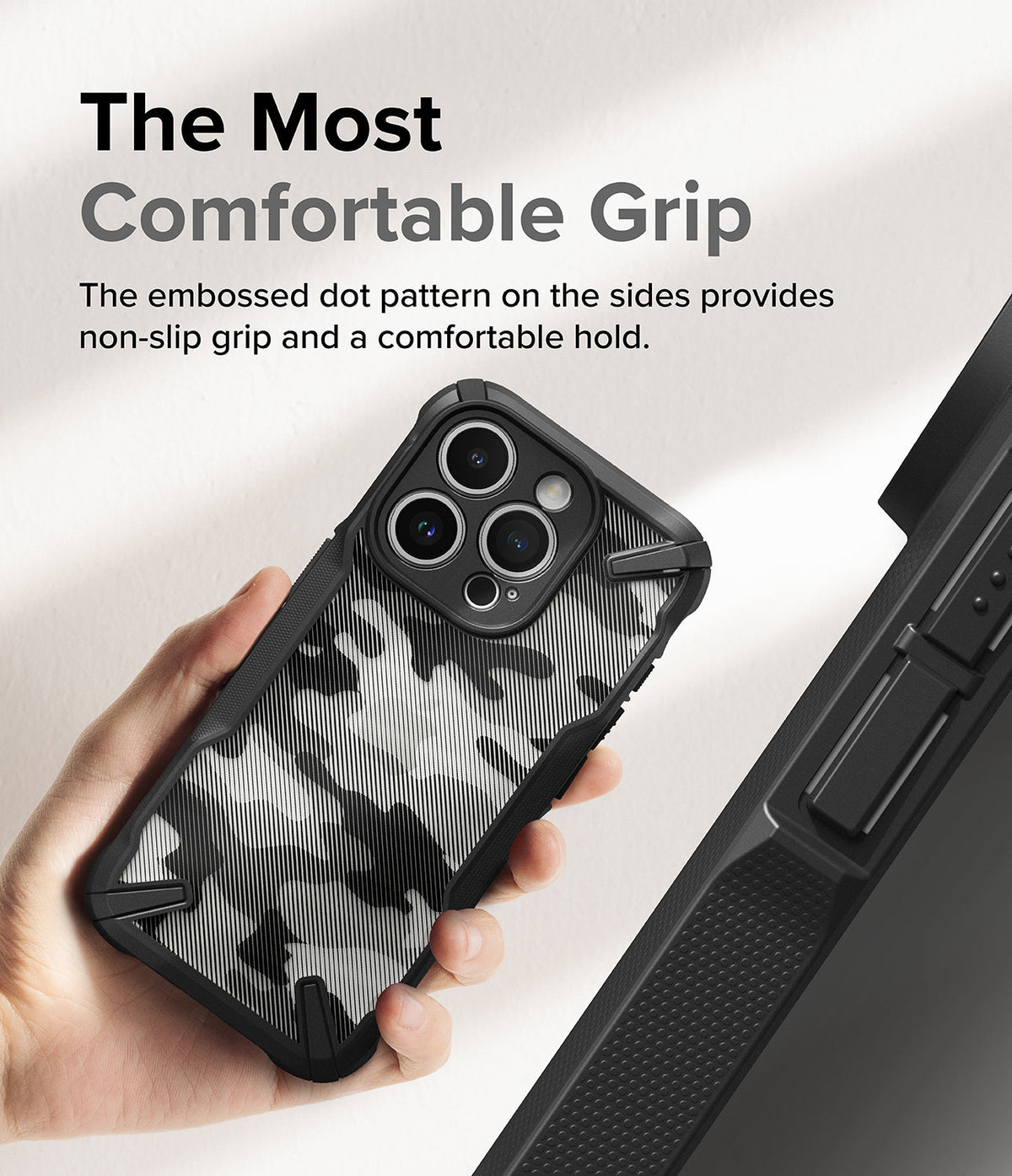 iPhone 15 Pro Case | Fusion-X - Hand holding a camo-patterned phone case with textured side grips and a triple-lens camera cutout.