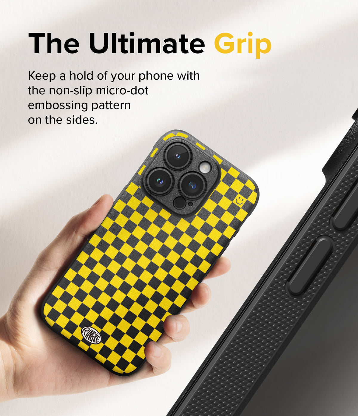iPhone 15 Pro Case | Onyx Design - Hand holding a yellow and black checkered phone case with micro-dot side grip texture.