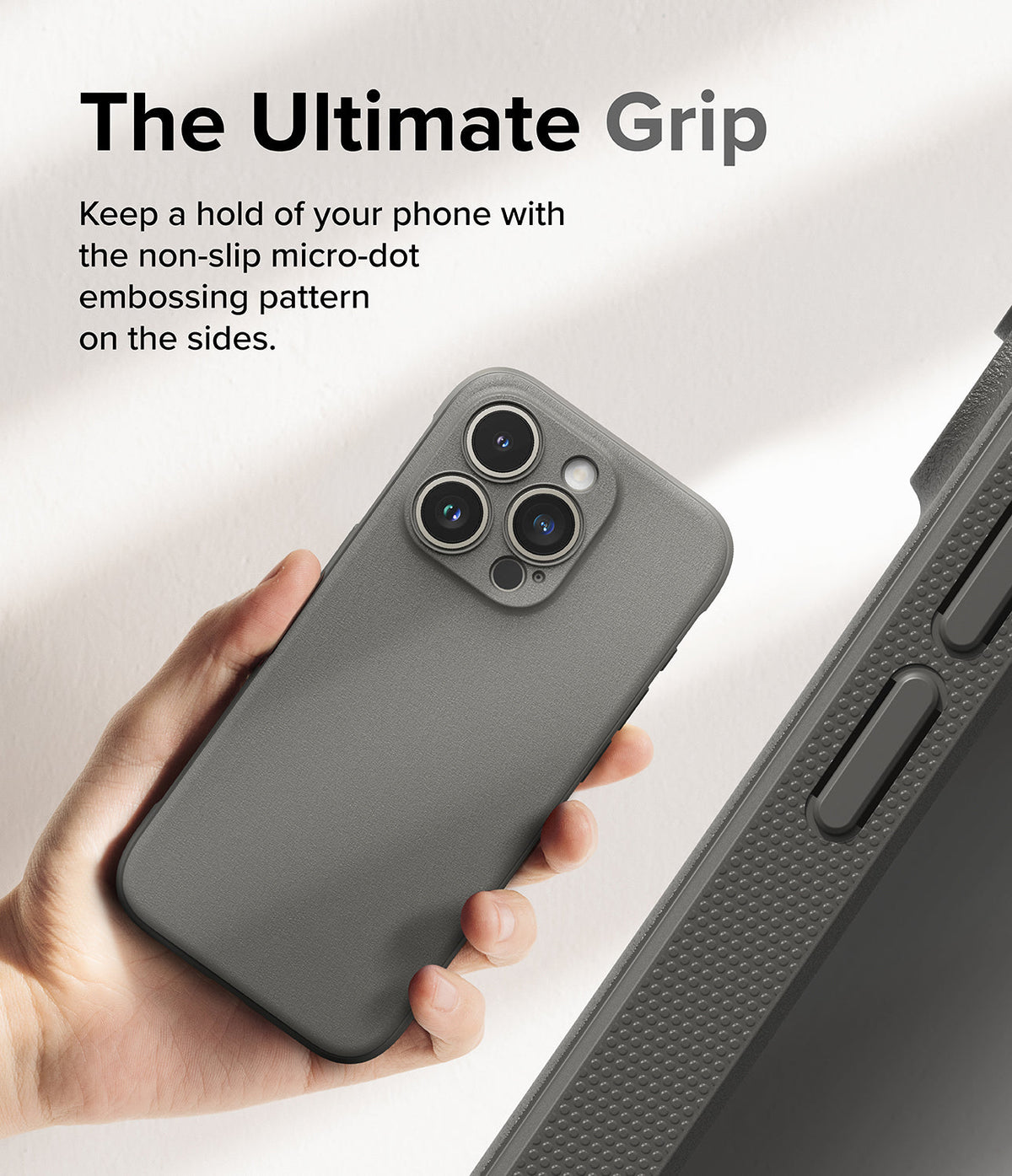 iPhone 15 Pro Case | Onyx - Hand holding a grey phone case with a textured micro-dot side grip pattern.