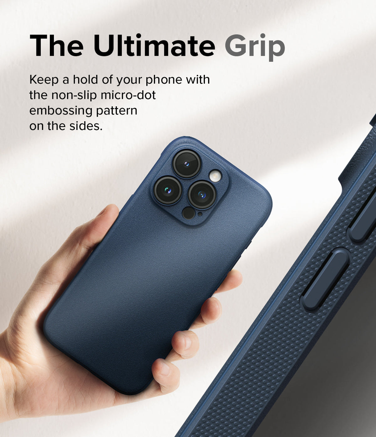 iPhone 15 Pro Case | Onyx - Hand holding a navy phone case showing a textured micro-dot grip pattern on the side edges.
