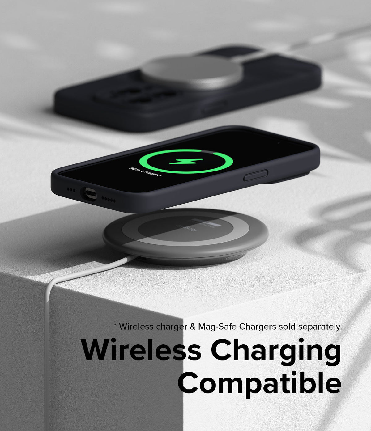 iPhone 15 Pro Case | Silicone Magnetic - Black iPhone 15 Pro case magnetically charging on a wireless pad.