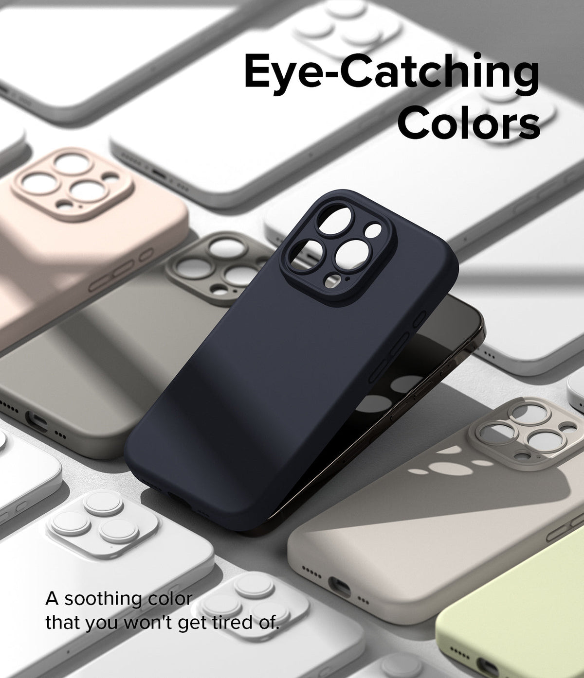 iPhone 15 Pro Case | Silicone Magnetic - A dark blue phone case resting on a collection of cases in various pastel colors.