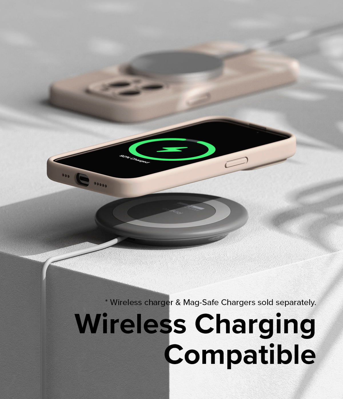 iPhone 15 Pro Case | Silicone Magnetic - Beige iPhone 15 Pro case hovering over a wireless charging pad.