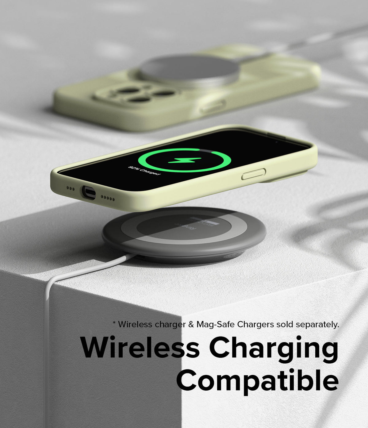 iPhone 15 Pro Case | Silicone Magnetic - Light yellow phone case on a wireless charger showing a charging icon on screen.