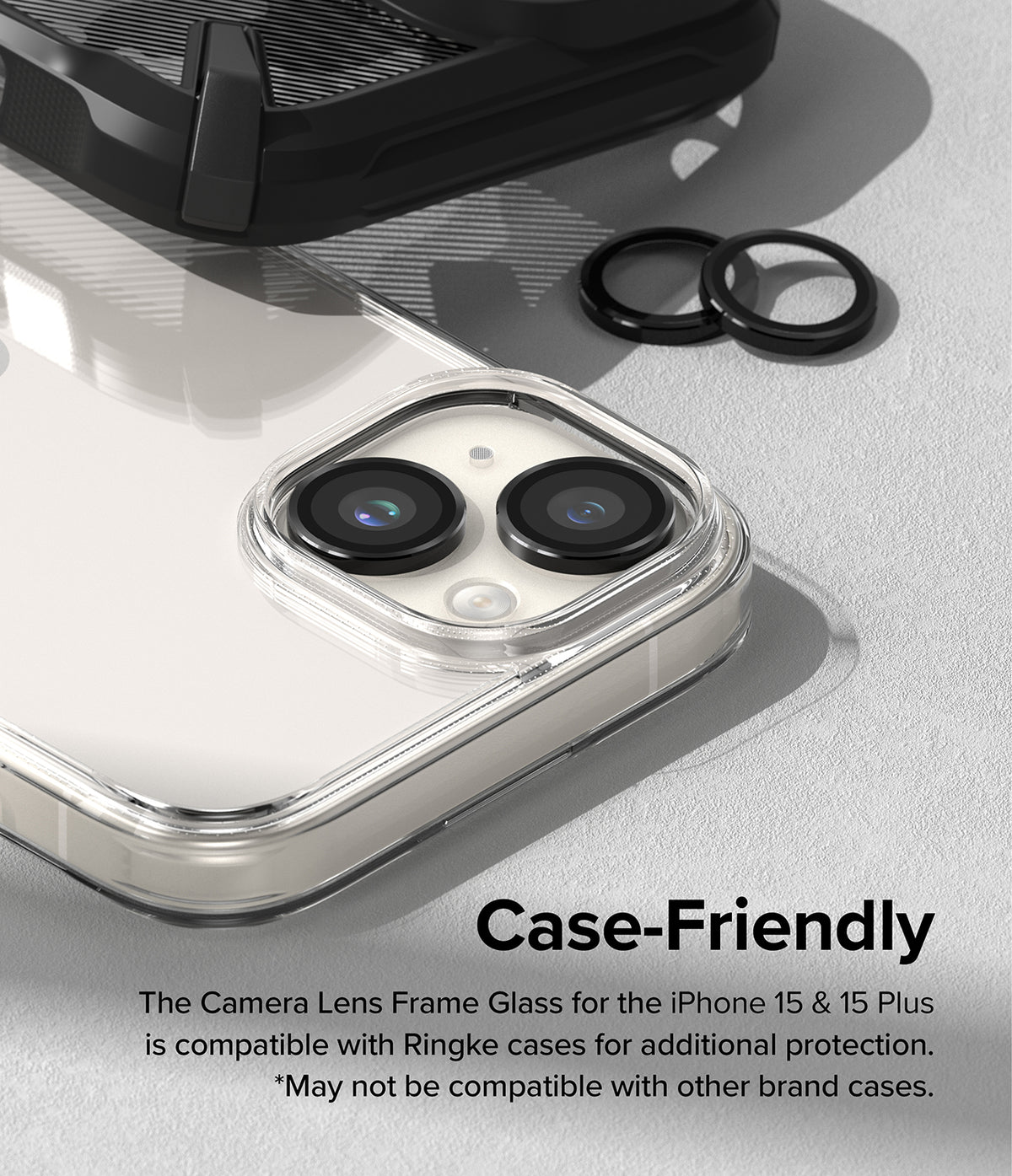 iPhone 15 Plus / 15 | Camera Lens Frame Glass - Black lens protectors installed on an iPhone camera with a clear case.