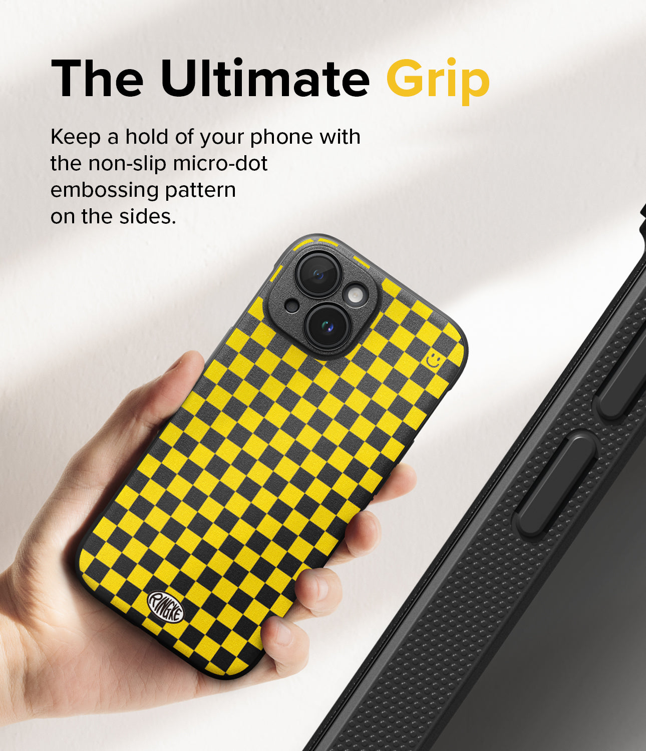 iPhone 15 Plus Case | Onyx Design - Hand holding a yellow and black checkered phone case with micro-dot side grip texture.