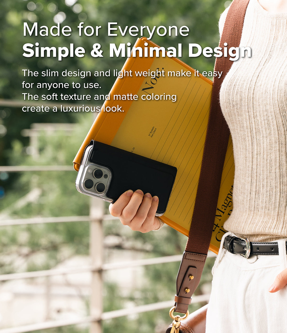 iPhone Pro Max & Plus MagSafe Cover | Folio Wallet Magnetic - Person holding a black magnetic wallet case on an iPhone.