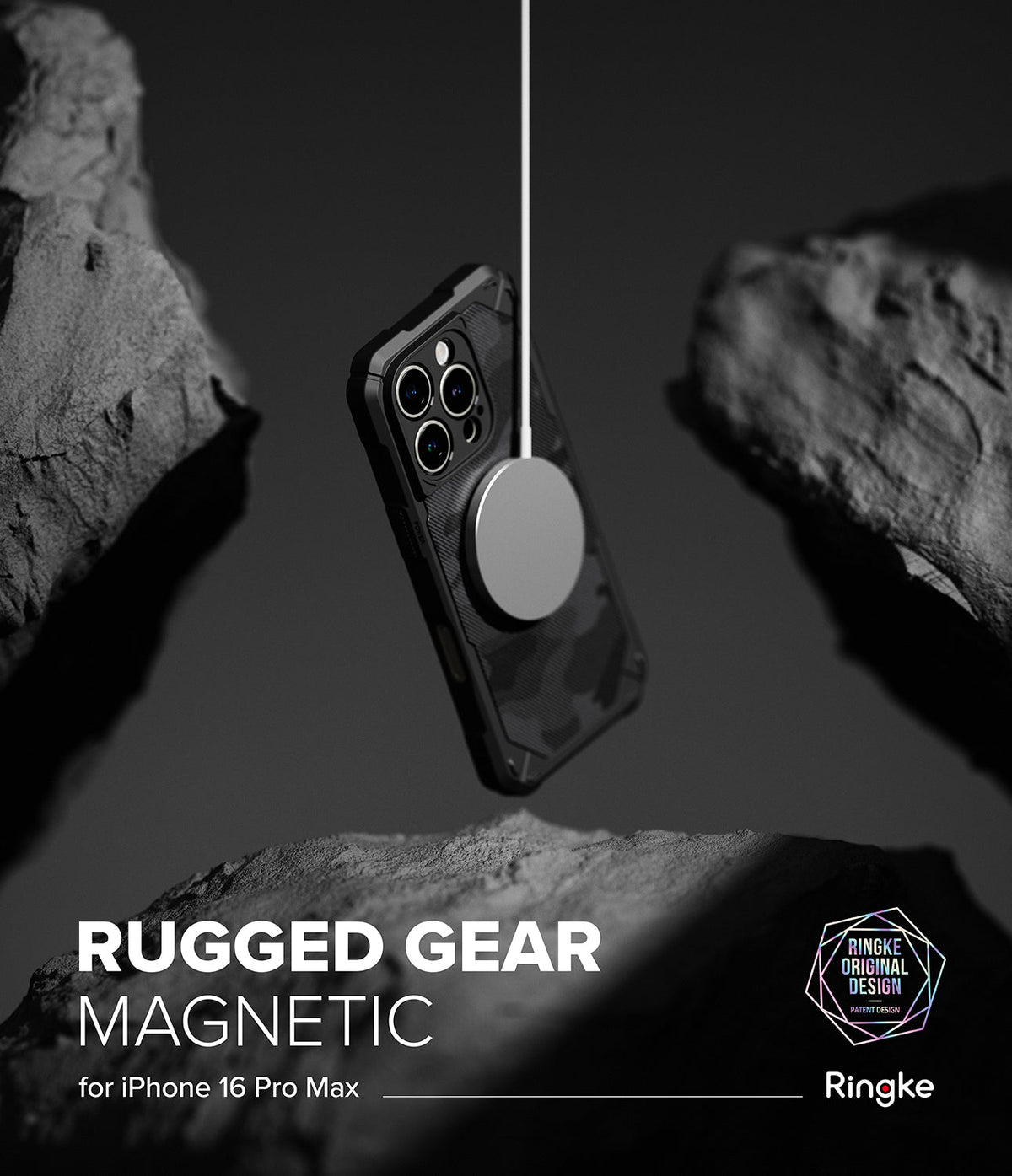 iPhone 16 Pro Max Case | Rugged Gear Magnetic - A rugged, camo-patterned phone case suspended by a magnetic charger between dark rocks.