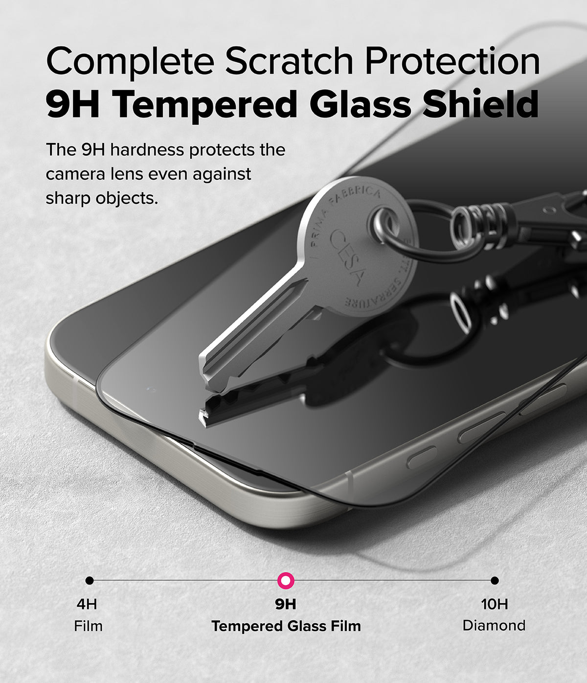 iPhone 16 Pro Max Screen Protector | Easy Slide Tempered Glass - iPhone 16 Pro Max Screen Protector - A metal key rests on a 9H tempered glass screen protector atop a smartphone.