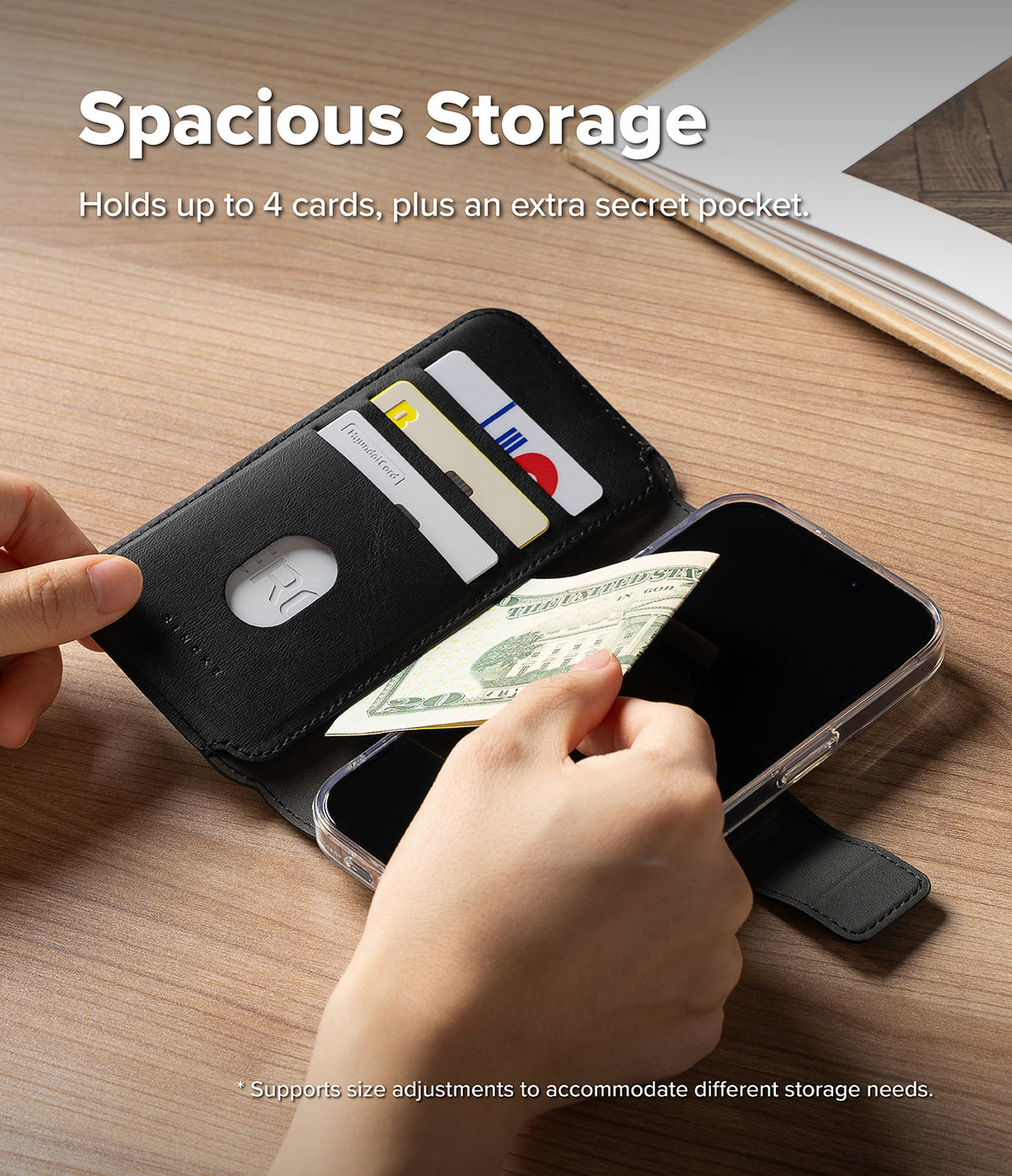 iPhone 16 Pro Cover | Folio Grip Wallet Magnetic - iPhone 16 Pro Cover - Black folio wallet case open, showing cards and cash being inserted into slots on a wooden desk.