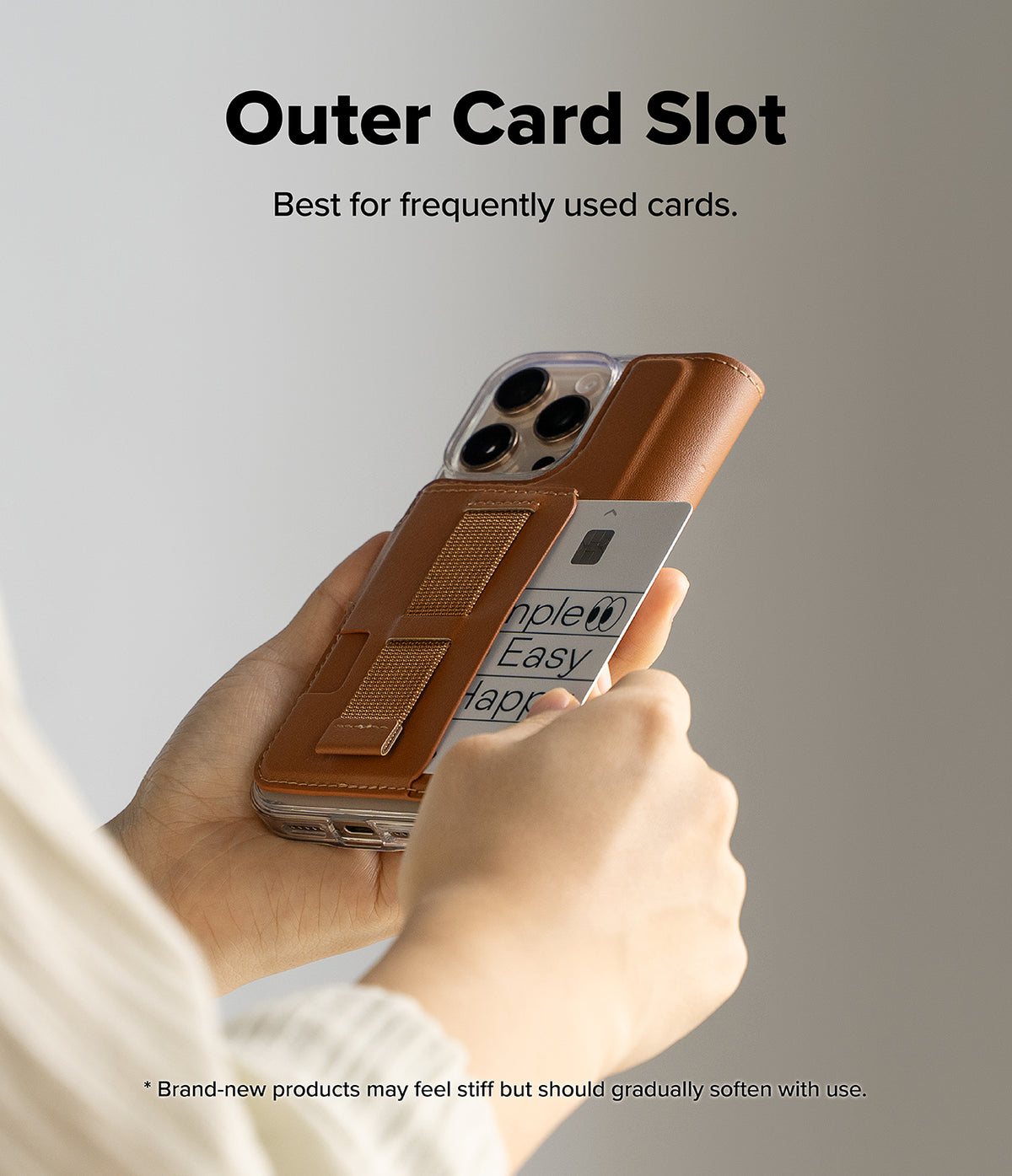 iPhone 16 Pro Cover | Folio Grip Wallet Magnetic - iPhone 16 Pro Cover - Hands holding a brown leather folio phone case with an outer card slot and elastic finger grip.