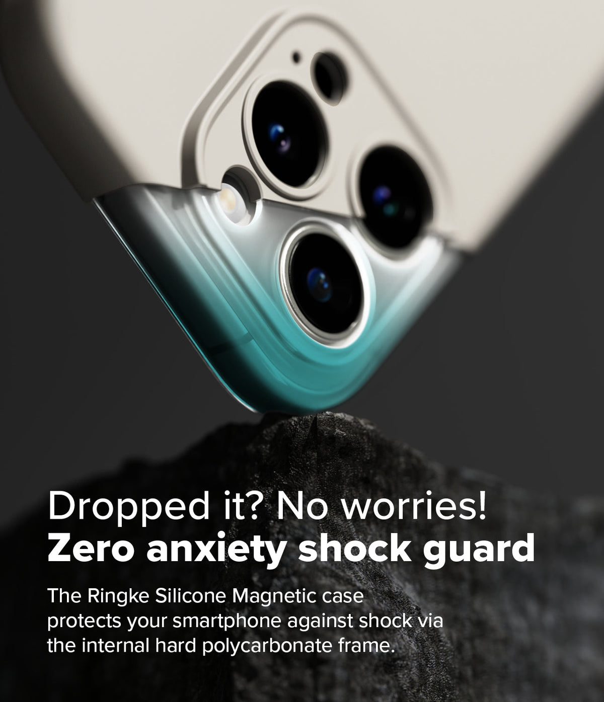 iPhone 16 Pro Case | Silicone Magnetic - Close-up of a phone camera module protected by a shock-absorbing frame resting on rock.