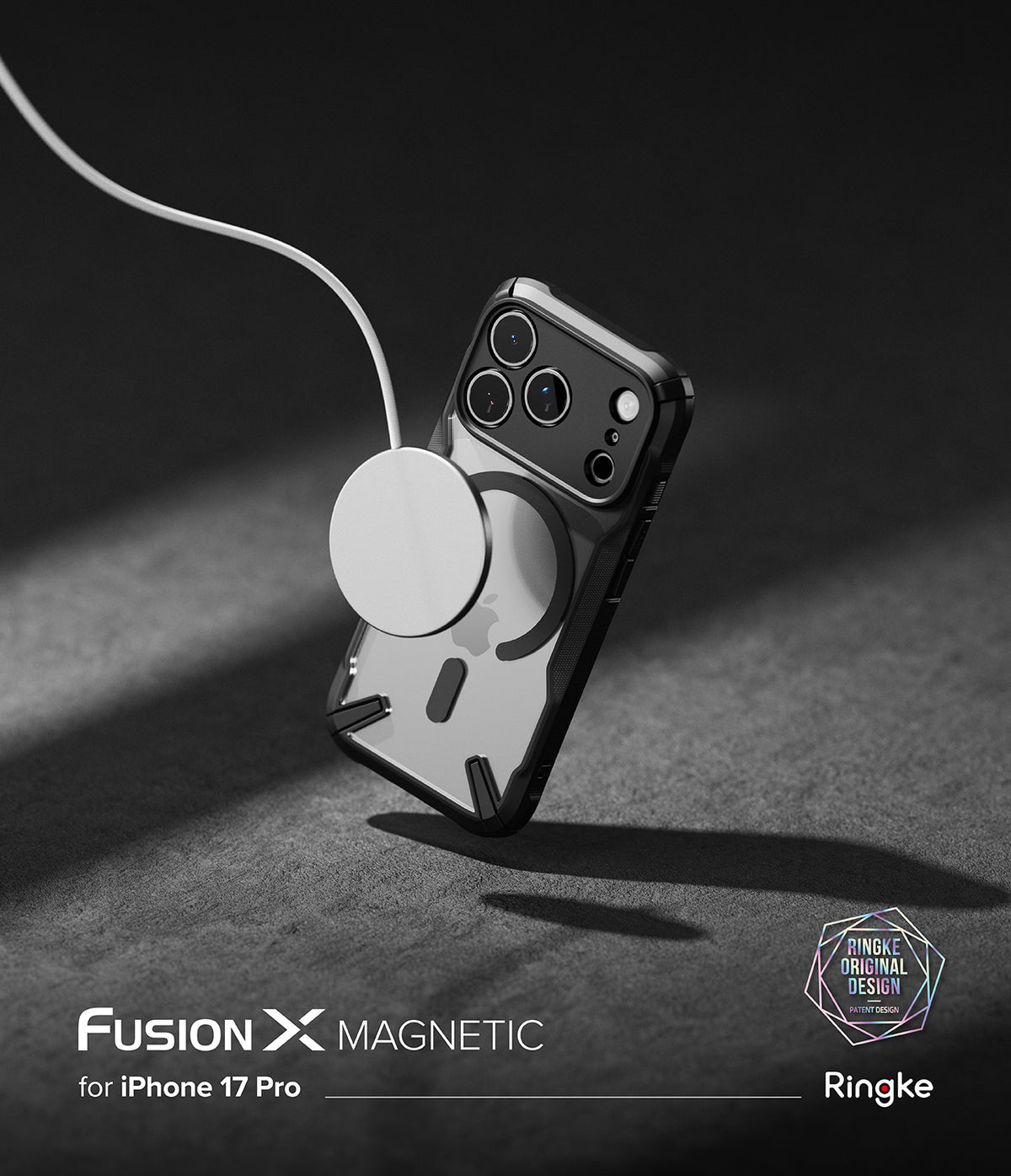 iPhone 17 Pro Case | Fusion-X Magnetic - Black protective case on an iPhone 17 Pro attached to a magnetic charger.