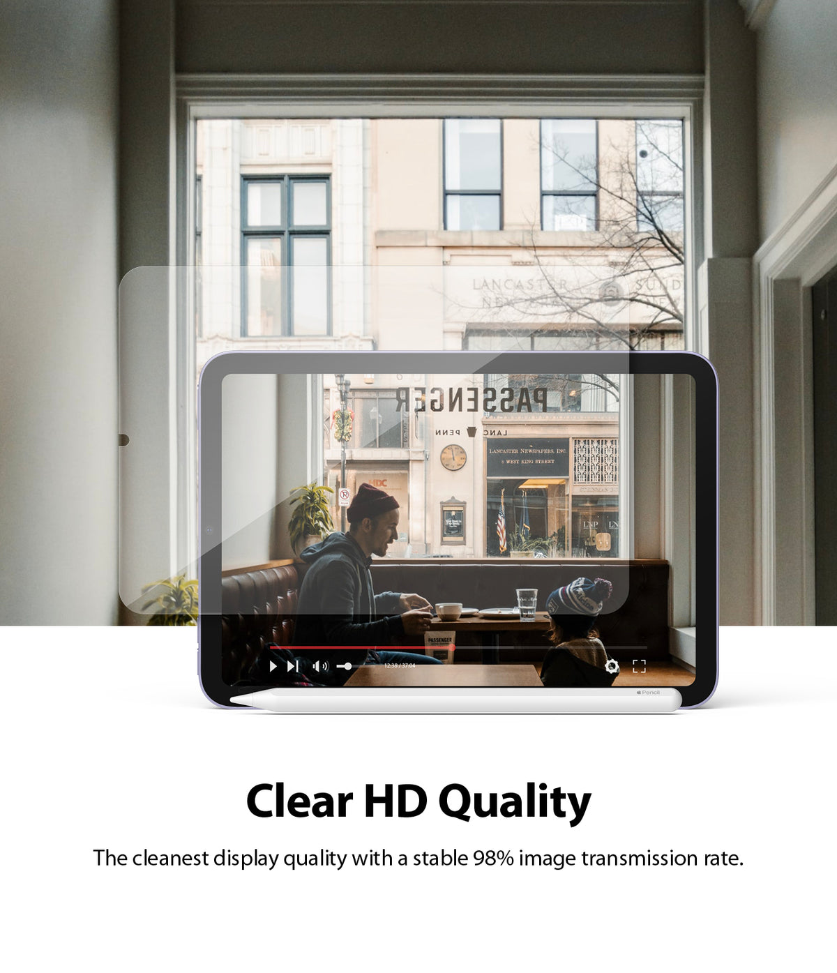 Tempered Glass | iPad - Clear screen protector hovering over an iPad displaying a high-definition video of a cafe scene.