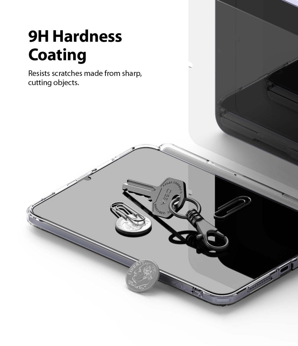 Tempered Glass | iPad - Keys, paperclips, and a coin resting on an iPad screen to demonstrate 9H scratch-resistant coating.