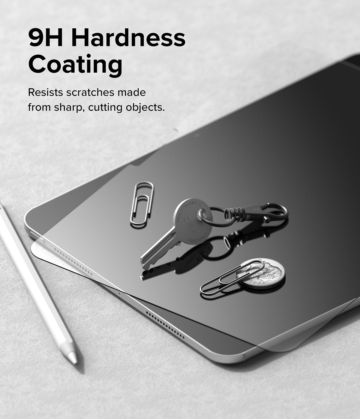 Easy Slide Tempered Glass | iPad - Keys, paperclips, and a coin resting on an iPad screen with 9H hardness coating text.