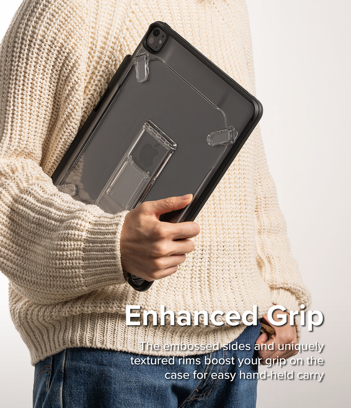 Fusion Sketch Stand | iPad - Person in a cream sweater holding a dark, transparent iPad case with an integrated kickstand.