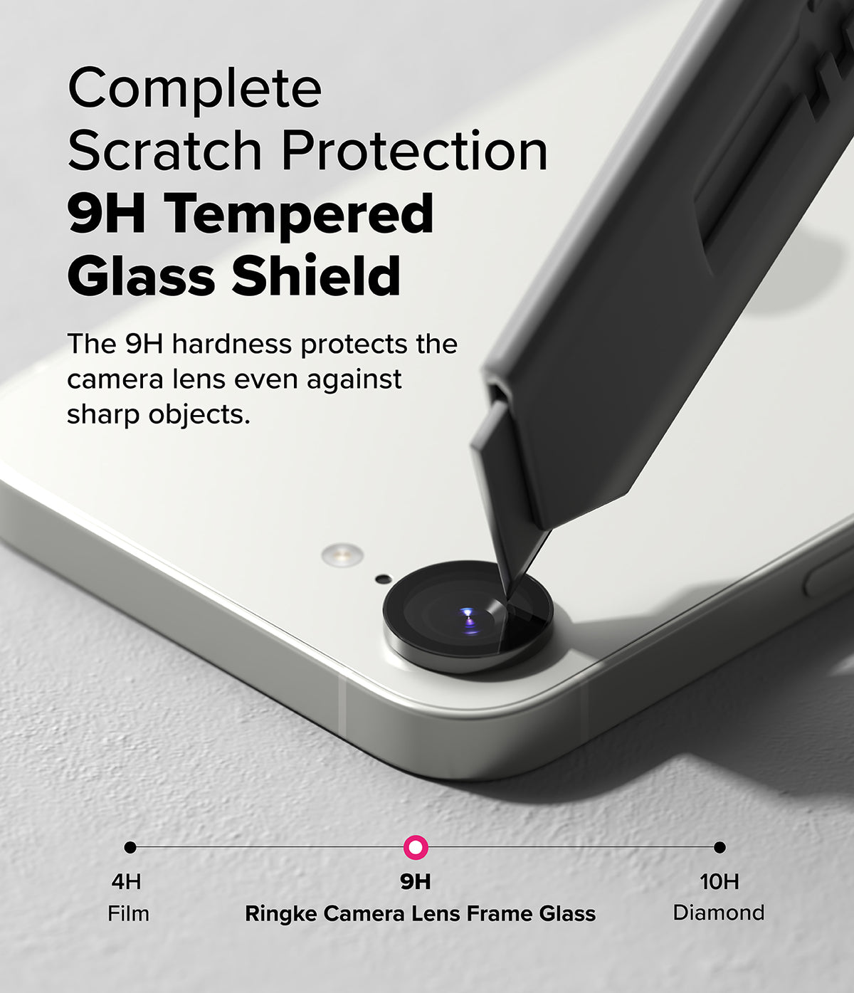 iPhone 17e / 16e | Camera Lens Frame Glass - iPhone 17e / 16e - A utility knife blade presses against a phone camera lens protector, demonstrating 9H scratch resistance.
