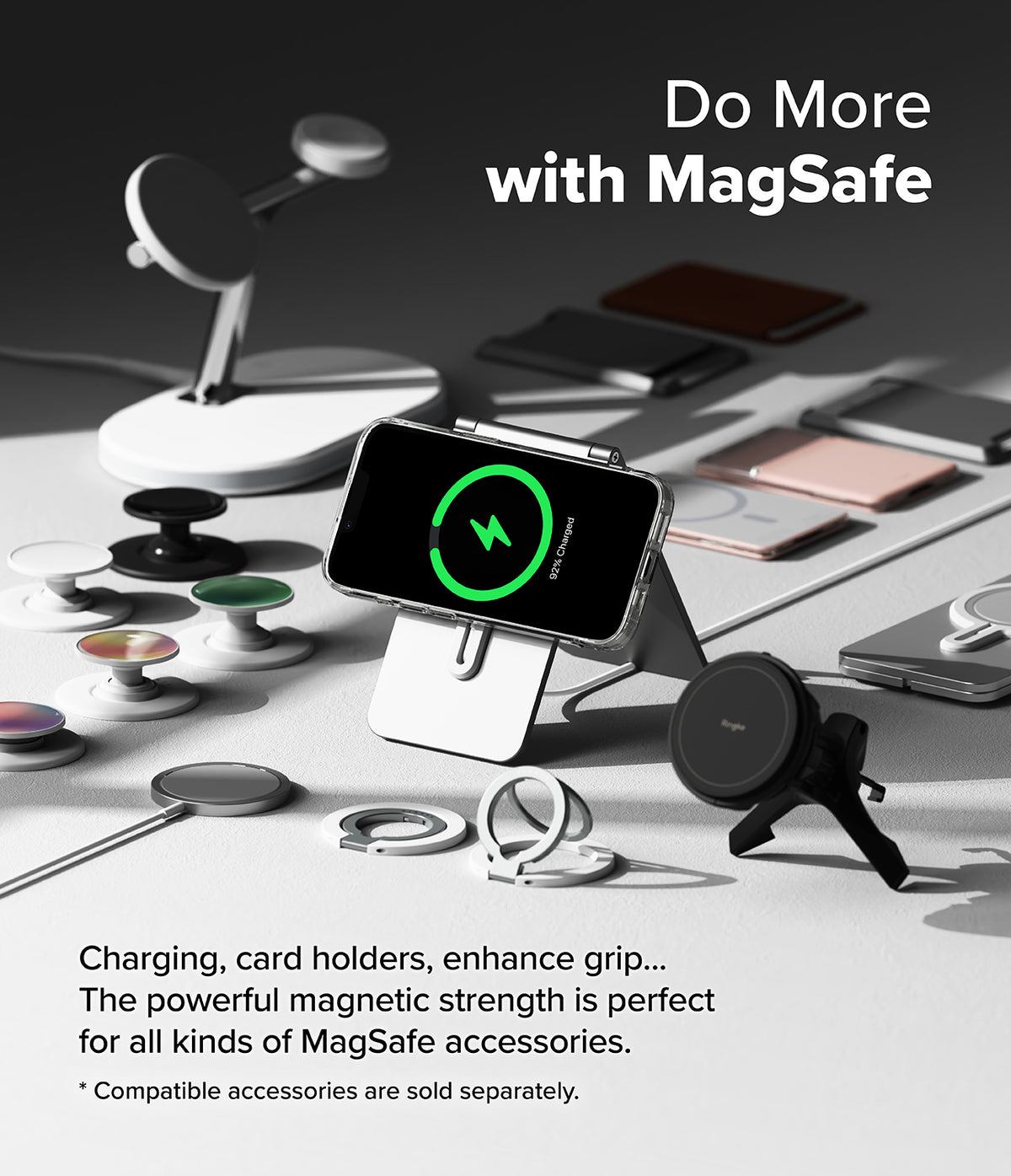 iPhone 16e Case | Fusion Magnetic - Smartphone in a clear case charging on a stand surrounded by various MagSafe accessories.