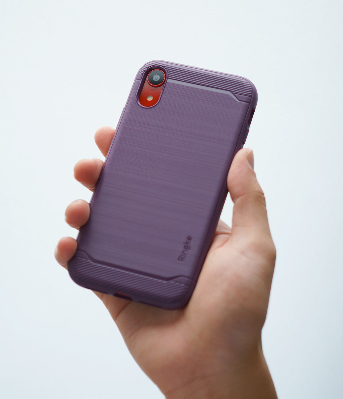 iPhone XR Case | Onyx - A hand holding a lilac purple phone case with a brushed texture and ribbed top and bottom accents.