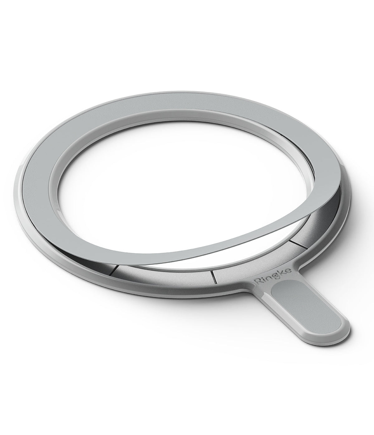 Ringke Magnetic Plate - A grey circular magnetic ring with an adhesive backing partially peeled off and a small handle.