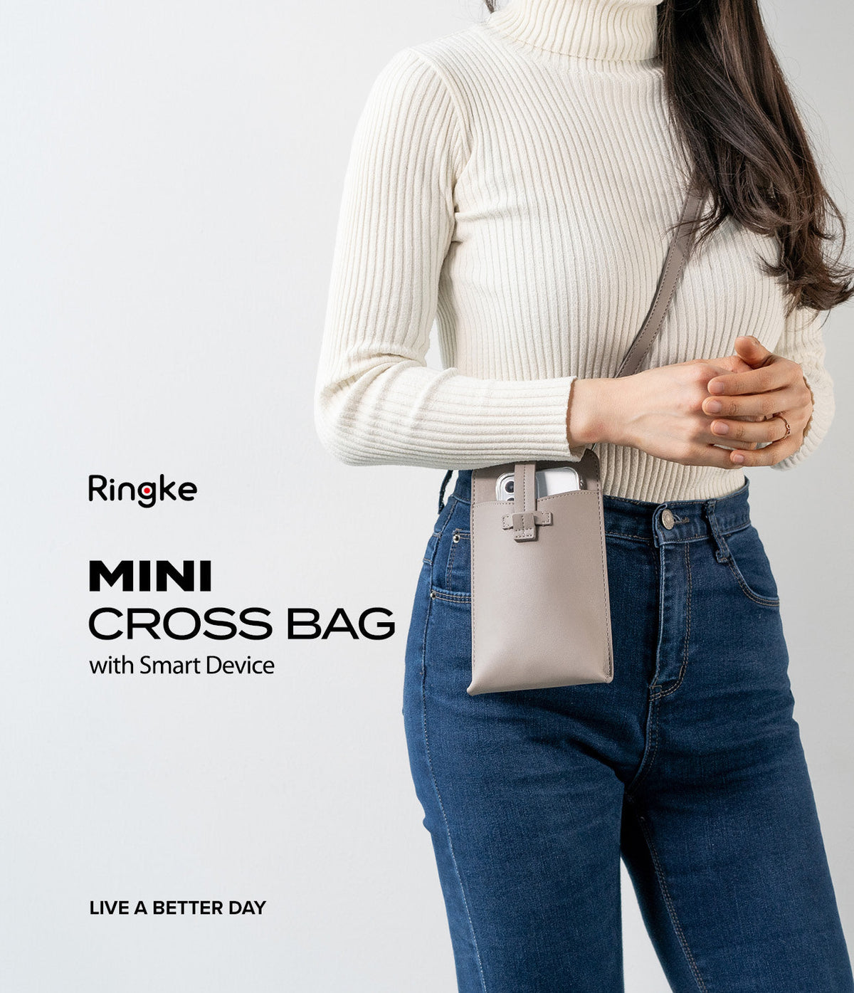 Mini Cross Bag | PU Leather - Woman wearing a beige PU leather mini crossbody bag holding a smartphone against a white background.