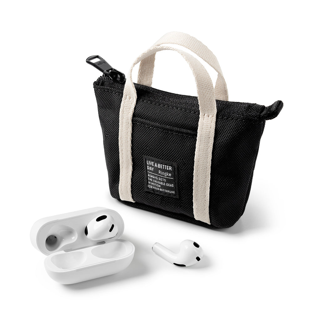 Mini Pouch | Tote Bag - Black canvas mini tote bag with white handles and a label next to an open white wireless earbud case.