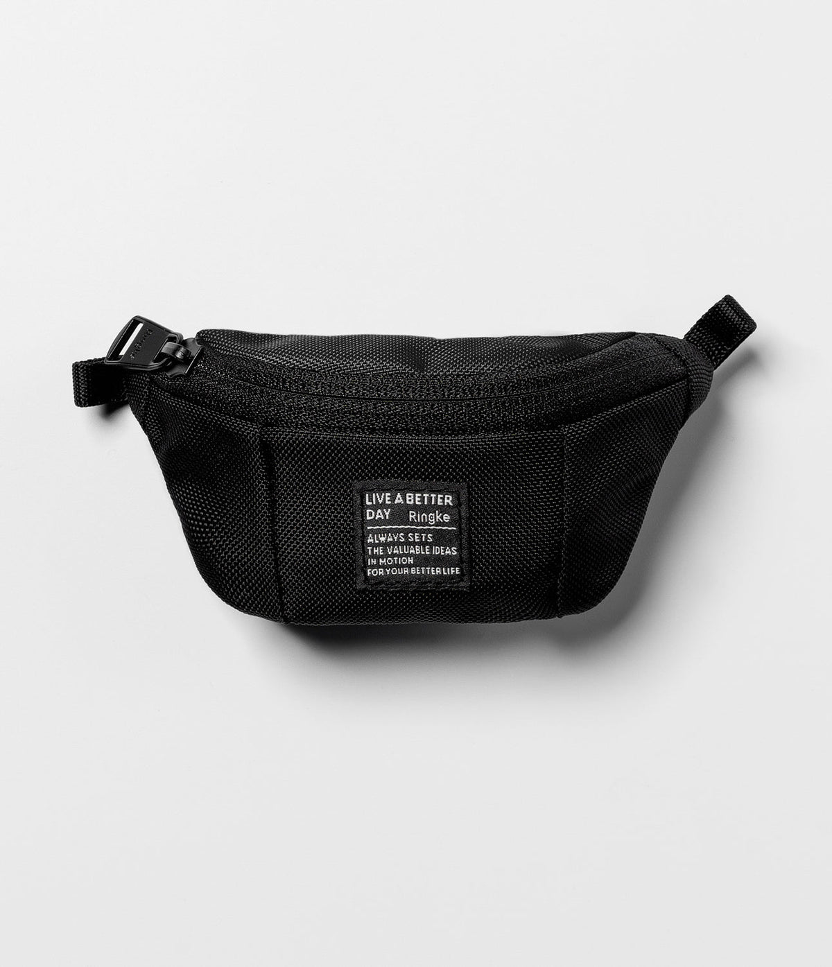 Mini Pouch | Sling Bag - Black textured mini sling bag with a rectangular patch featuring white text on a light gray background.