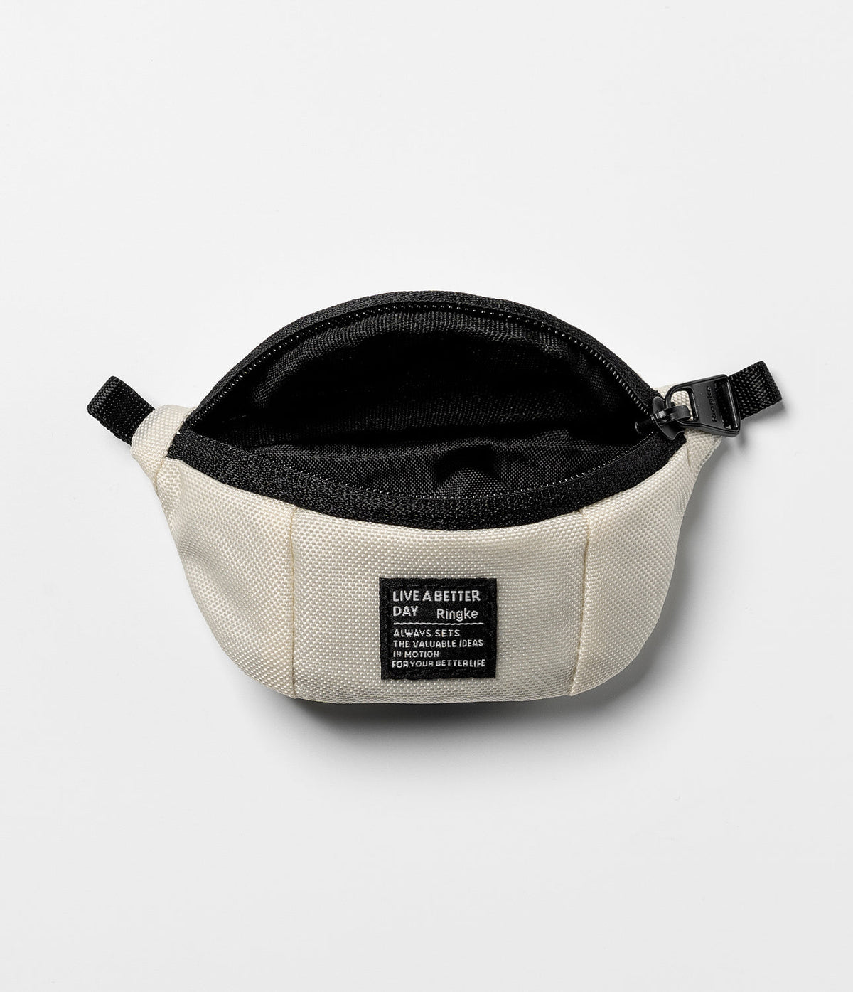 Mini Pouch | Sling Bag - Open cream-colored canvas pouch with black zipper and a rectangular brand label on the front.