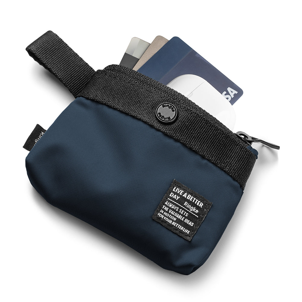 Mini Pouch | 2-Way Bag Miniature - Navy blue zippered pouch containing credit cards and a white wireless earbud case.