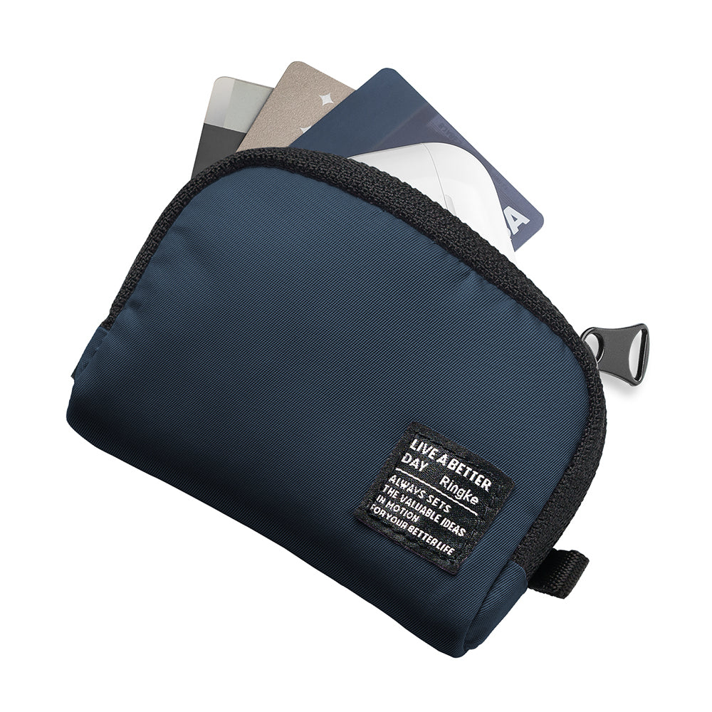 Mini Pouch | Half-Pocket - Navy blue zippered pouch with a branded fabric tag containing three credit cards.