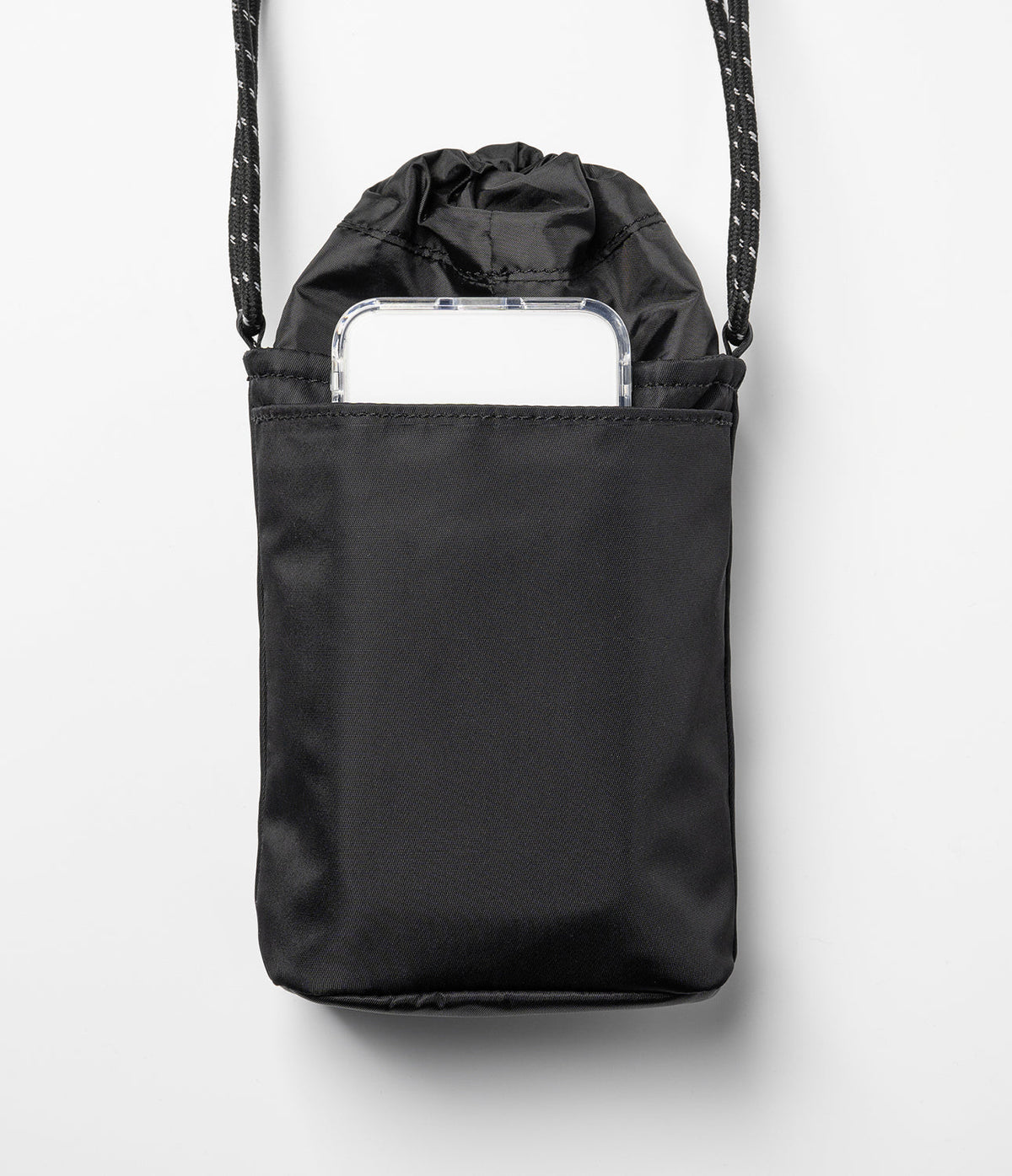 Mini Cross Bag | Bucket Bag - Black drawstring bucket bag with a smartphone tucked into the front pocket and a patterned strap.