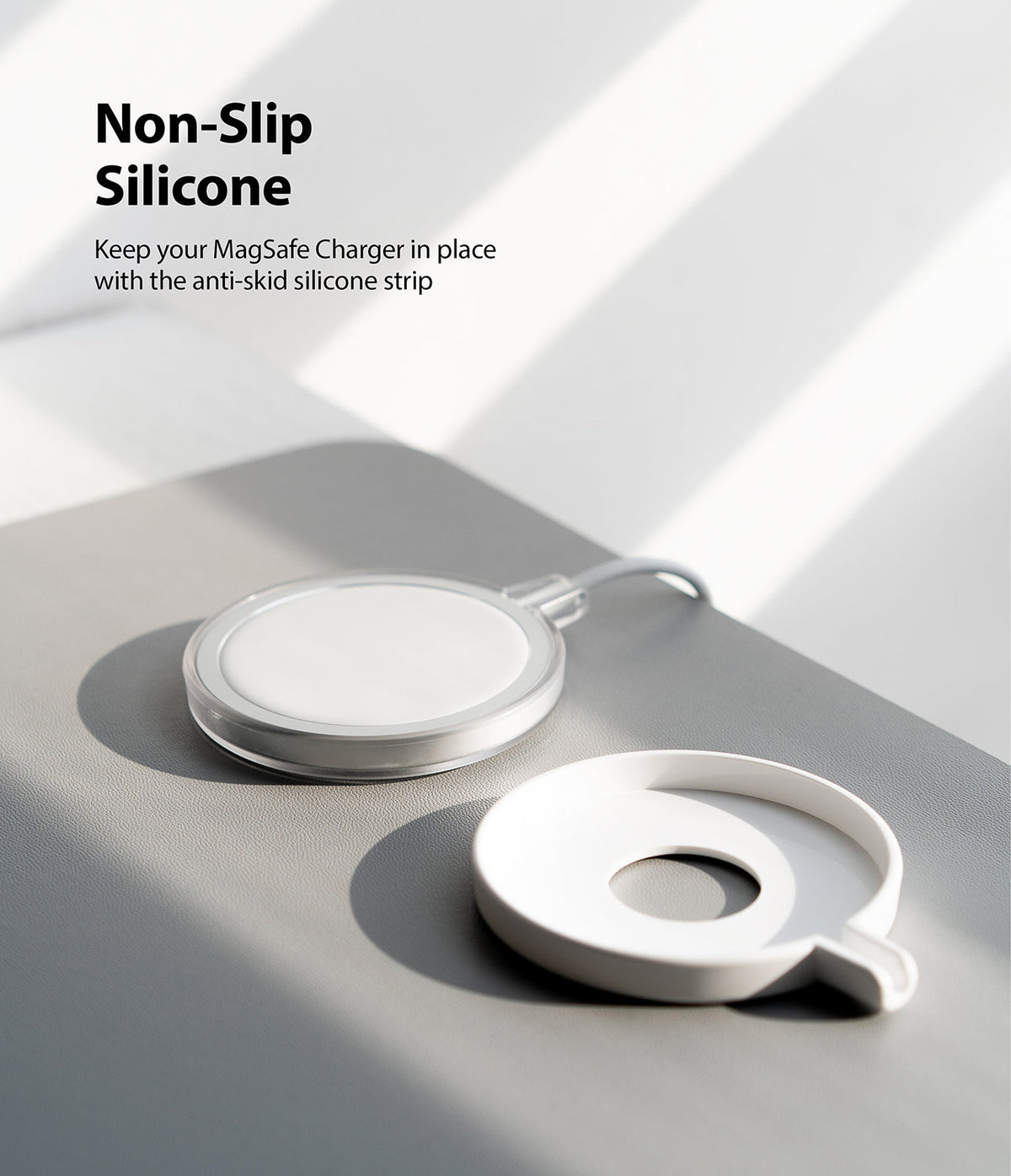 MagSafe Charger Case | Slim - A MagSafe charger next to its white, non-slip silicone protective case on a gray surface.