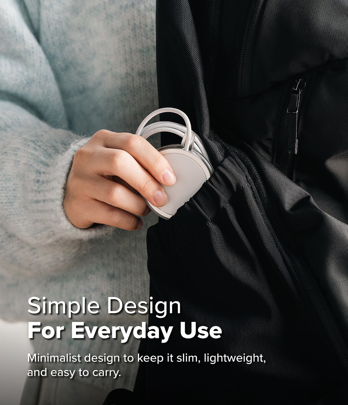 MagSafe (2024) Charger Case | Slim - Matte Clear - Hand placing a slim, matte clear MagSafe charger into a black backpack.