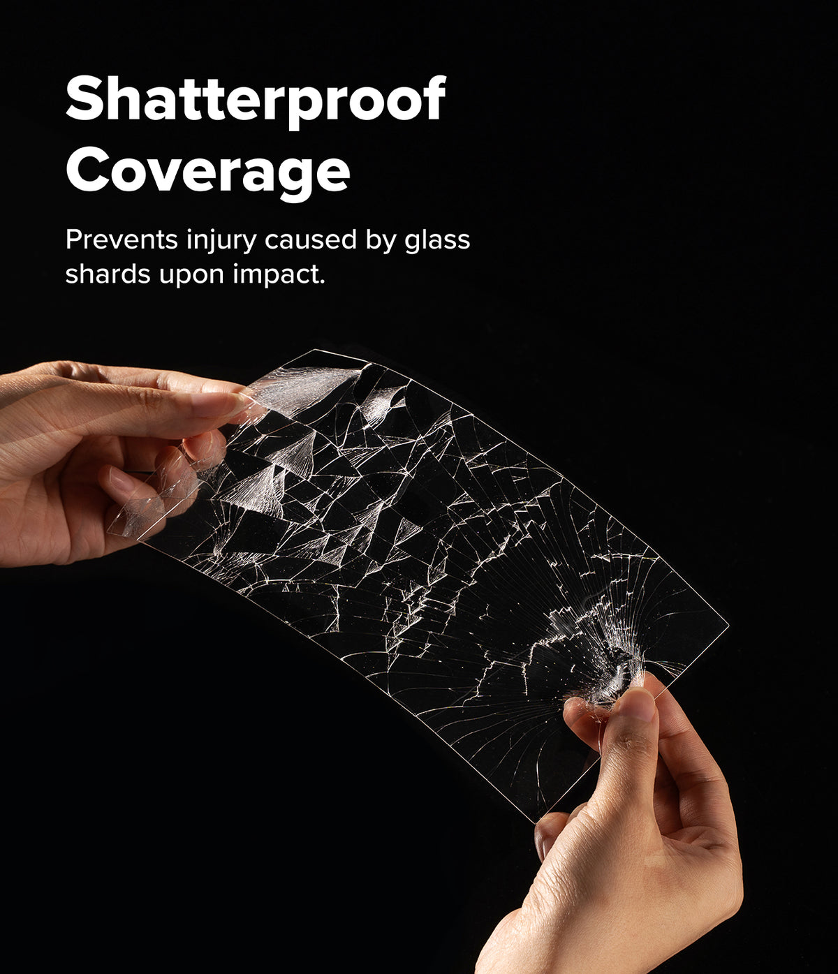 Nintendo Switch 2 | Easy Slide Tempered Glass - Hands holding a shattered tempered glass screen protector against black.