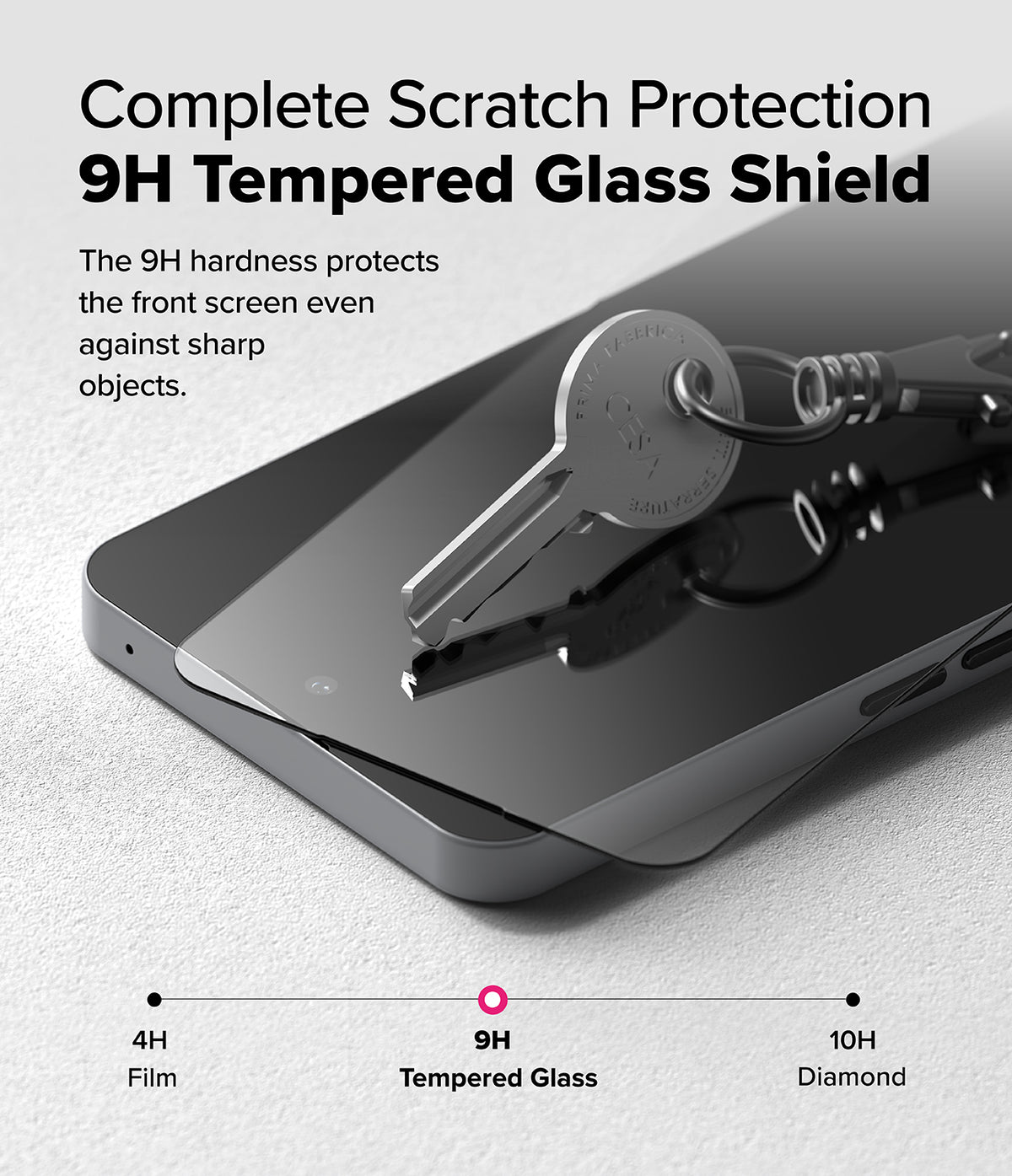 Nothing Phone (3a) / (3a) Pro Screen Protector | Easy Slide Tempered Glass - A metal key resting on a 9H tempered glass screen protector.