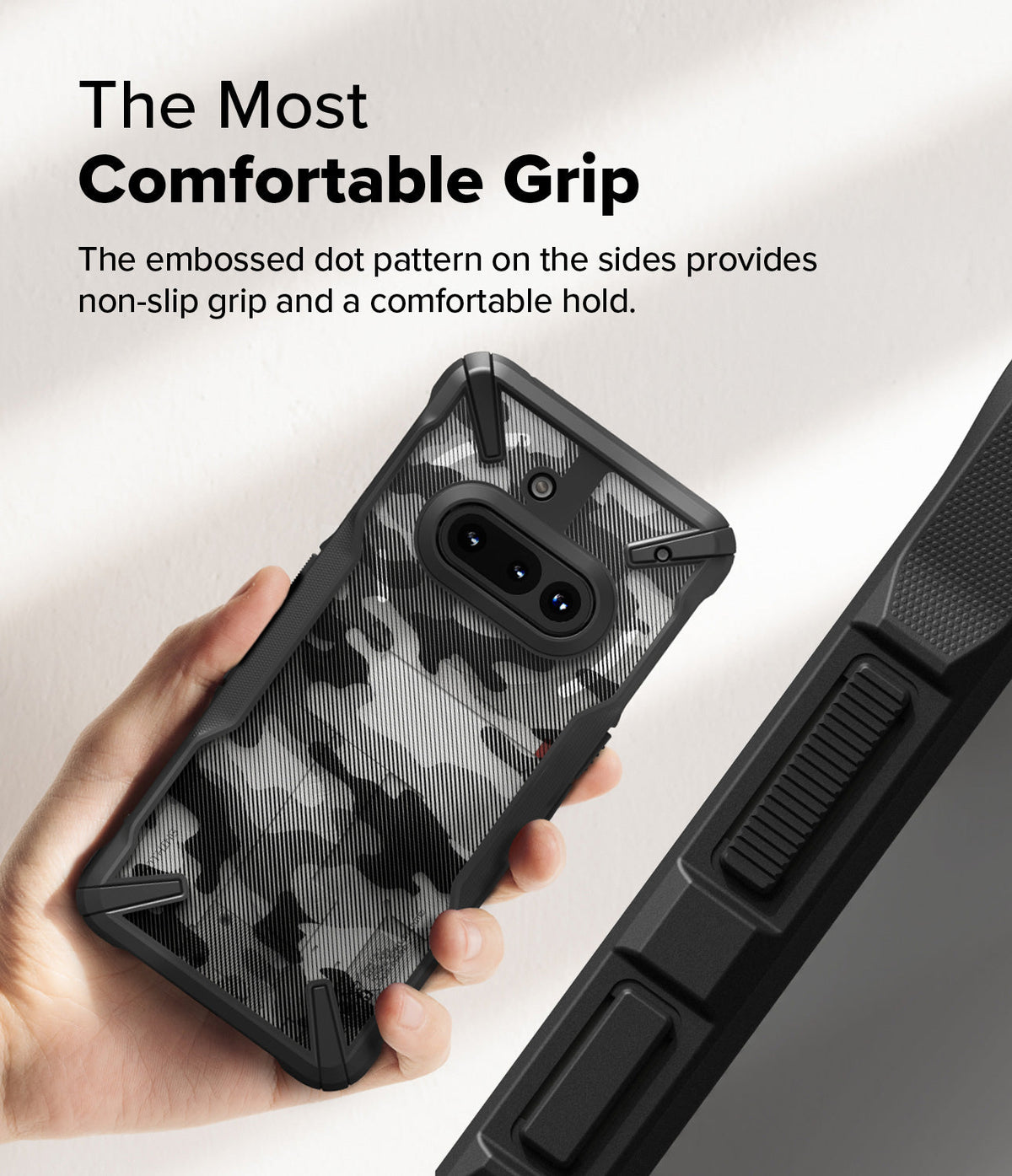 Nothing Phone (3a) Case | Fusion-X - Hand holding a camo-patterned phone case with textured side grips for a secure hold.