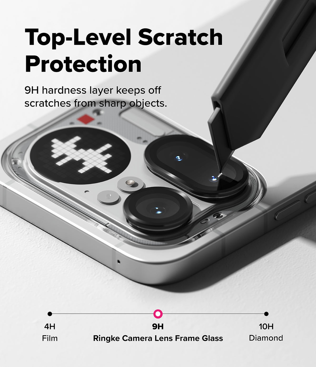 Nothing Phone (4a) Pro | Camera Glass (2P) - A utility knife scrapes a Nothing phone camera lens protector.
