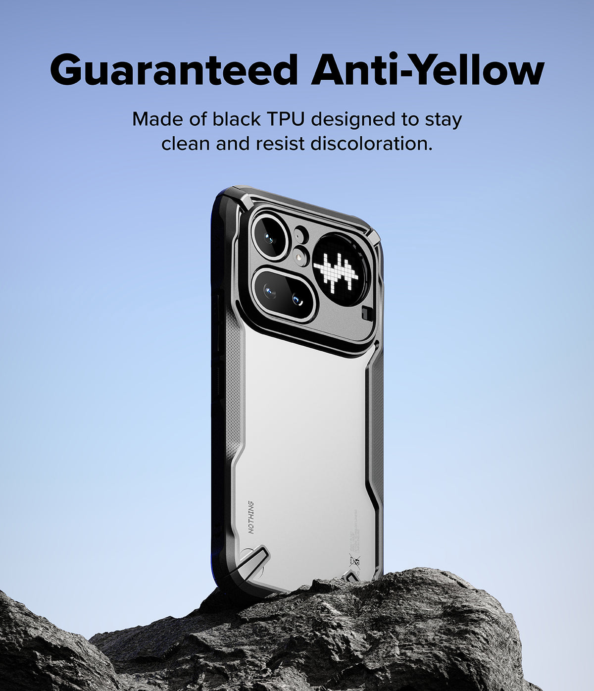 Nothing Phone (4a) Pro Case | Fusion-X - Black protective phone case on a rock against a blue sky with anti-yellow text.
