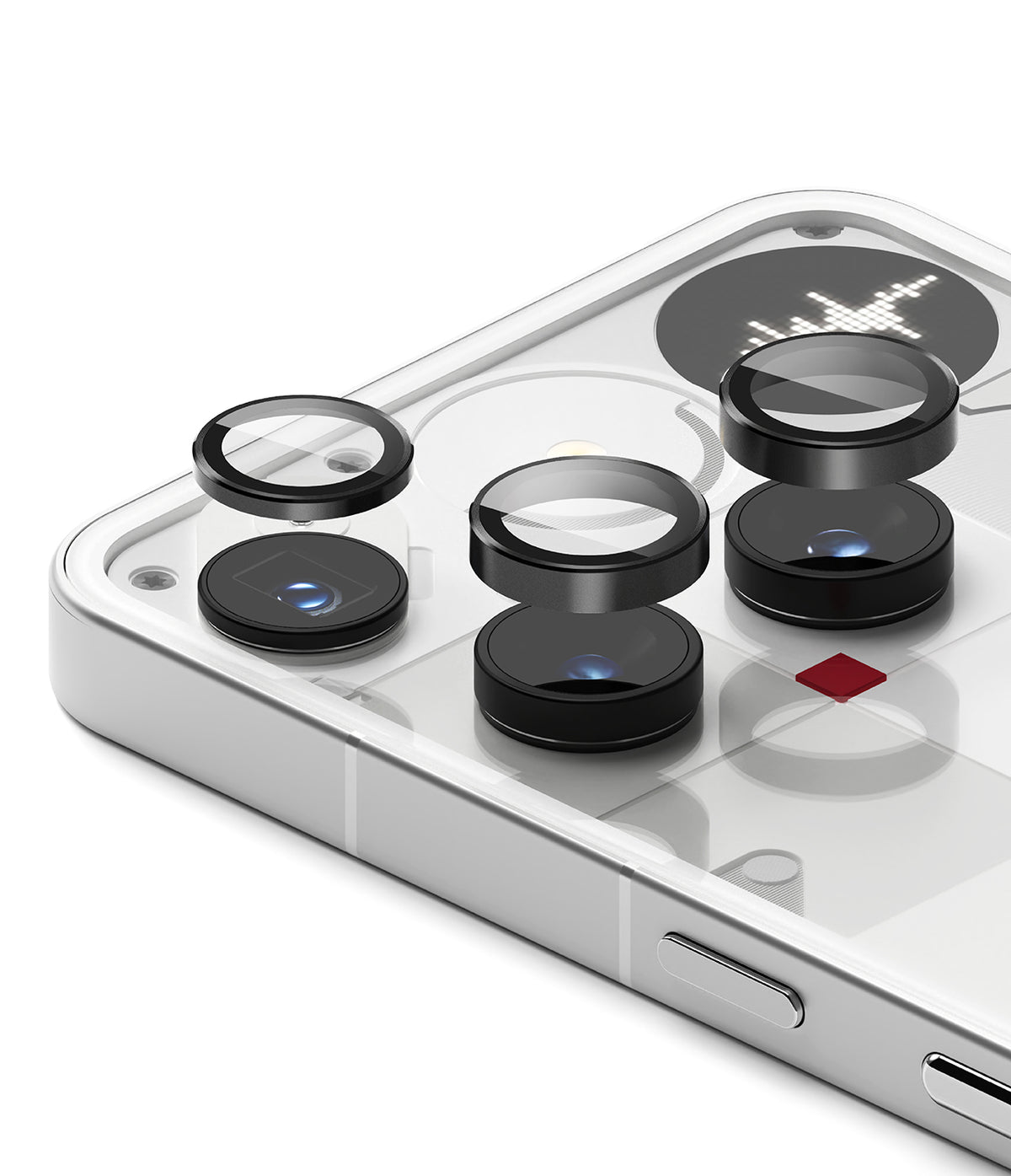 Nothing Phone (3) | Camera Glass - Three black circular lens protectors hovering above the camera lenses on a white phone.