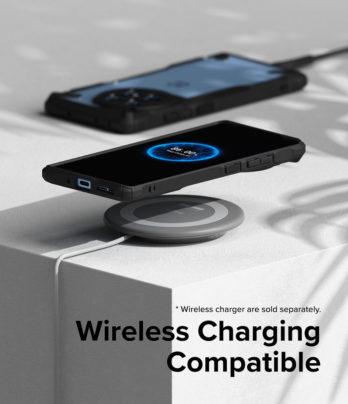 OnePlus 12R Case | Fusion-X - A smartphone in a black protective case charging wirelessly on a circular pad.