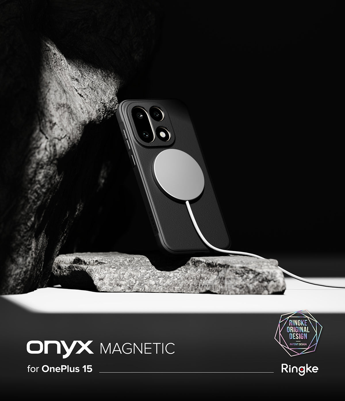 OnePlus 15 Case | Onyx Magnetic - Black phone case with magnetic charger attached, resting against a rock on a white surface.