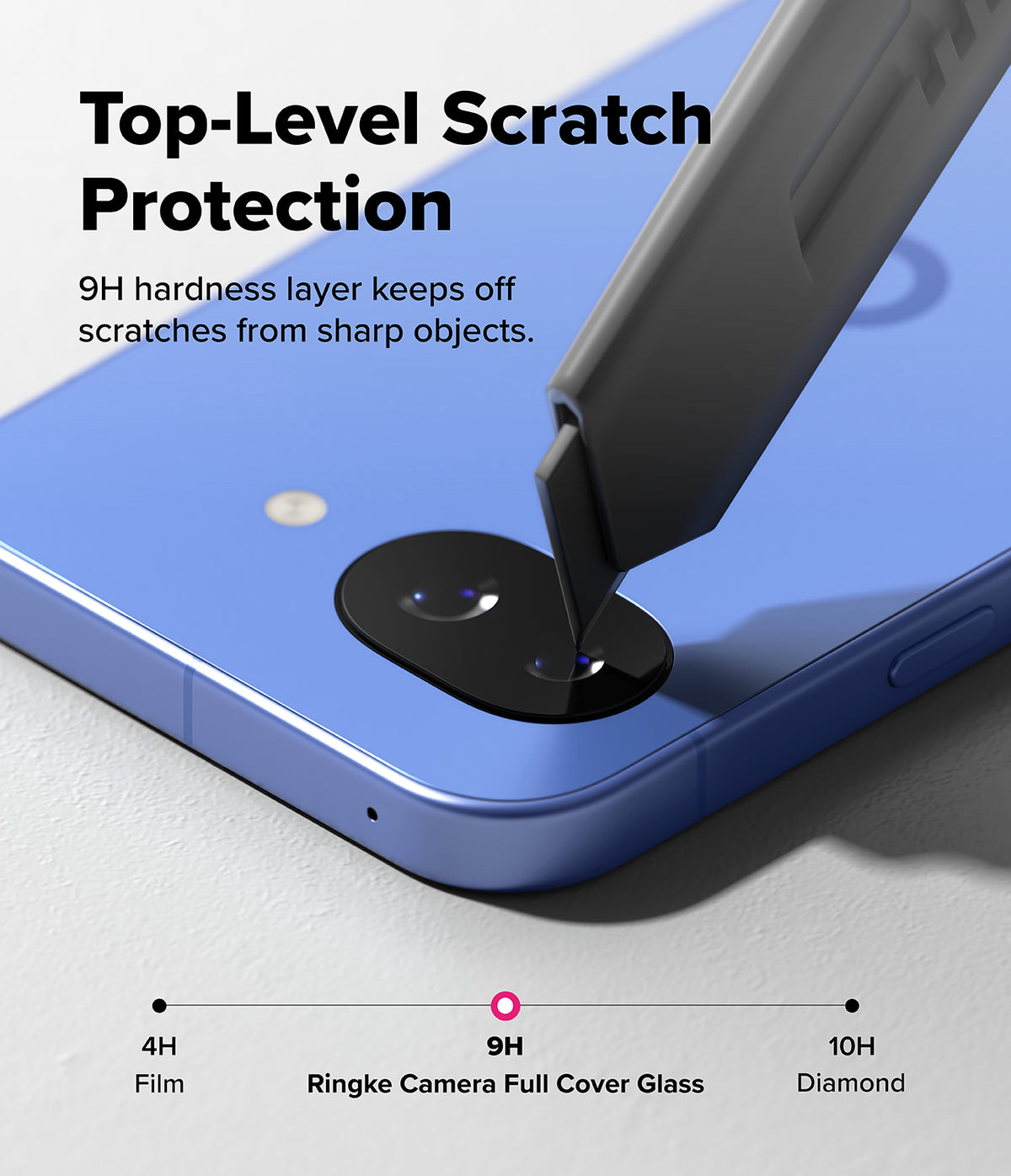 Google Pixel 10a | Camera Glass - A utility knife blade presses against a blue phone's camera lens protector to demonstrate 9H hardness.