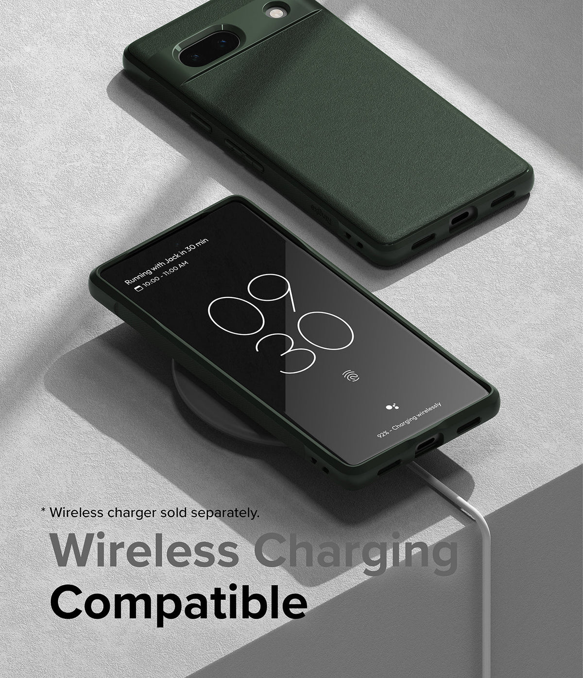 Google Pixel 7a Case | Onyx - Dark green phone case on a wireless charging pad showing a digital clock display.